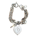 Marc Jacobs heart-shaped chain watch on white background