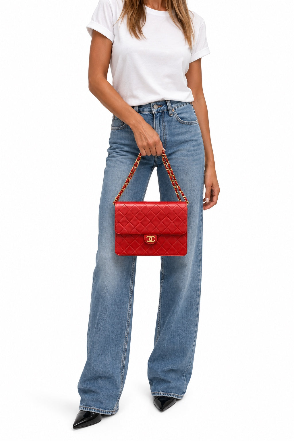 Chanel Classic red bag carried by hand