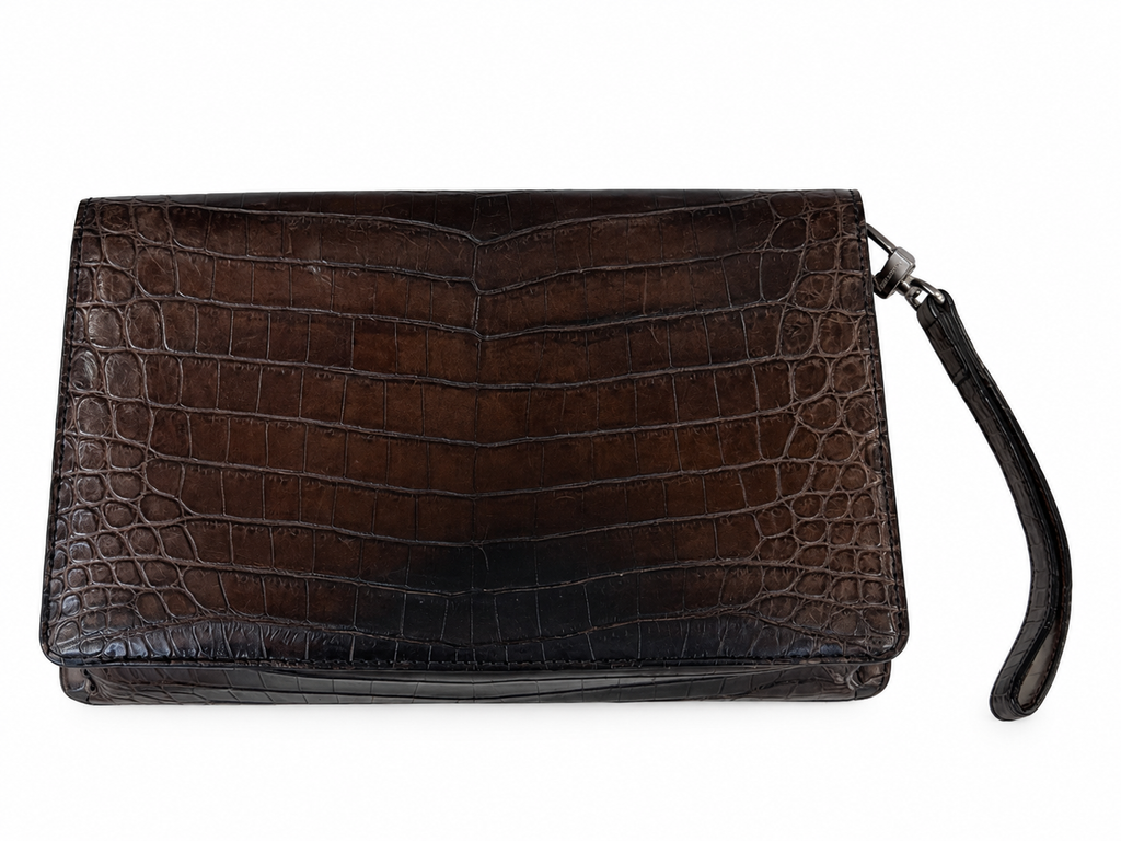 Louis Vuitton crocodile clutch back view on white background