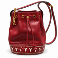 Yves Saint Laurent vintage burgundy bucket bag front with exact slender YSL charm
